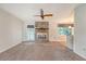 Comfortable living room features a brick fireplace and a ceiling fan, ready to welcome you at 110 Jackson Rd, Ladson, SC 29456