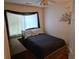 Cozy bedroom with a comfortable bed, neutral décor, and a decorative 'Gathering' wall decal at 113 Saxton Ct, Goose Creek, SC 29445