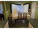 Charming dining area with patterned flooring, a traditional table, and blue accents, bathed in natural light at 113 Saxton Ct, Goose Creek, SC 29445