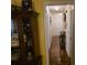 Hallway with hardwood floors, stylish furnishings, and neutral walls leading to various rooms in the home at 113 Saxton Ct, Goose Creek, SC 29445