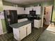 Functional kitchen features white cabinets, stainless steel appliances, and a convenient center island at 113 Saxton Ct, Goose Creek, SC 29445