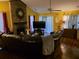 Inviting living room with a striking brick fireplace, a large TV, and comfortable leather seating at 113 Saxton Ct, Goose Creek, SC 29445