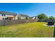 Spacious backyard, featuring a patio with outdoor dining set, and fenced perimeter for privacy at 1146 Moss Grove Dr, Moncks Corner, SC 29461