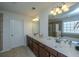 Bathroom with double sinks, soaking tub, tiled shower, and natural light from the window at 1146 Moss Grove Dr, Moncks Corner, SC 29461
