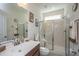 Bright bathroom featuring a glass enclosed shower, wood vanity and framed wall art for a comforting feel at 1146 Moss Grove Dr, Moncks Corner, SC 29461
