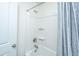 Clean white bathroom with a shower-tub combo, featuring a gray curtain and silver fixtures at 1146 Moss Grove Dr, Moncks Corner, SC 29461
