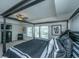 Spacious bedroom featuring a four poster bed, tray ceilings, ceiling fan and carpeted floors at 1146 Moss Grove Dr, Moncks Corner, SC 29461