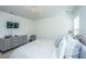 Comfortable bedroom features a large bed, dresser, TV and natural light at 1146 Moss Grove Dr, Moncks Corner, SC 29461