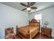 Cozy bedroom with a decorative ceiling fan, and wood furnishings including a bed and nightstand at 1146 Moss Grove Dr, Moncks Corner, SC 29461
