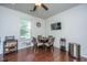 Bright dining area with a round table, modern chairs, and a window for natural light at 1146 Moss Grove Dr, Moncks Corner, SC 29461