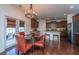 Eat-in kitchen and dining area featuring modern lighting, dark wood floors, granite counters and lots of cabinet space at 1146 Moss Grove Dr, Moncks Corner, SC 29461