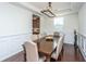 Bright dining room featuring hardwood floors, a modern chandelier, and a six-person dining table at 1146 Moss Grove Dr, Moncks Corner, SC 29461