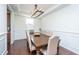 Bright dining room with hardwood floors, a modern chandelier, and a six-person dining table at 1146 Moss Grove Dr, Moncks Corner, SC 29461