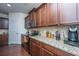 Kitchen with dark cabinets and stainless steel appliances plus granite counters and lots of storage space at 1146 Moss Grove Dr, Moncks Corner, SC 29461