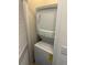 Small laundry room with stacked washer and dryer unit at 1146 Moss Grove Dr, Moncks Corner, SC 29461