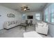 Cozy living room with a ceiling fan, two sofas, two chairs and plush carpeting at 1146 Moss Grove Dr, Moncks Corner, SC 29461