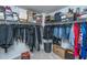 Large walk-in closet with custom shelving, hanging rods, shoe storage, and lots of storage space at 1146 Moss Grove Dr, Moncks Corner, SC 29461