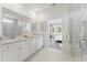 Bathroom featuring marble floors, double vanity, quartz countertops, and glass enclosed shower at 1149 Darling St, Summerville, SC 29485