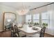 Elegant dining room with a large table, stylish chairs, and sophisticated lighting at 1149 Darling St, Summerville, SC 29485