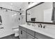 Modern bathroom featuring a double sink vanity, large mirror, and glass enclosed shower at 116 Backhurst Dr, Summerville, SC 29486