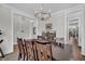 Elegant dining room with hardwood floors and a long table to host friends and Gathering at 116 Backhurst Dr, Summerville, SC 29486