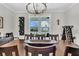 Elegant dining room with hardwood floors, a wooden table, and stylish wine rack at 116 Backhurst Dr, Summerville, SC 29486
