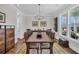 Formal dining room featuring hardwood floors, a wooden table, and stylish decor at 116 Backhurst Dr, Summerville, SC 29486