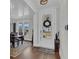 Bright entryway with hardwood floors, a wreath on the door, and a view of the dining room at 116 Backhurst Dr, Summerville, SC 29486