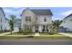Charming two-story home with a well-manicured front yard and inviting porch at 116 Backhurst Dr, Summerville, SC 29486