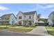 Beautiful two-story home with manicured lawn and a modern farmhouse design at 116 Backhurst Dr, Summerville, SC 29486