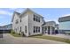 Beautiful two-story home boasts a screened-in porch and a well-manicured lawn at 116 Backhurst Dr, Summerville, SC 29486