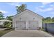 Detached two-car garage features carriage doors and professional landscaping at 116 Backhurst Dr, Summerville, SC 29486