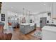 Bright kitchen featuring a large center island with a farmhouse sink and stainless steel appliances at 116 Backhurst Dr, Summerville, SC 29486