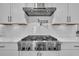 This kitchen features a stainless steel stove with a pot filler and white cabinets at 116 Backhurst Dr, Summerville, SC 29486