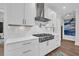 This kitchen features a stainless steel stove with a pot filler and white cabinets at 116 Backhurst Dr, Summerville, SC 29486