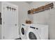 Convenient laundry room featuring a washer, dryer, and storage shelves at 116 Backhurst Dr, Summerville, SC 29486