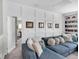 Open-concept living room showcasing a large sectional sofa, a wood coffee table, and access to multiple rooms at 116 Backhurst Dr, Summerville, SC 29486