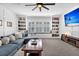 Bright living room with a sectional sofa, built-in bookshelves, and a flat screen TV at 116 Backhurst Dr, Summerville, SC 29486