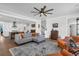 Elegant living room with hardwood floors, a comfortable gray sofa, and open to the kitchen at 116 Backhurst Dr, Summerville, SC 29486