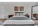 Comfortable main bedroom with a plush bed, decorative pillows, and stylish wall art at 116 Backhurst Dr, Summerville, SC 29486