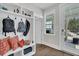 Bright mudroom features built-in storage, a bench with pillows, and convenient access to the outdoors at 116 Backhurst Dr, Summerville, SC 29486