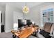 Bright office with a modern desk, and large light fixture at 116 Backhurst Dr, Summerville, SC 29486