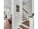 Elegant staircase with wood treads, white risers, and a matching handrail leading to the upper level at 116 Backhurst Dr, Summerville, SC 29486