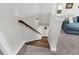 View of staircase with hardwood steps, white walls, and stylish sconce lighting at 116 Backhurst Dr, Summerville, SC 29486