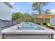 Modern backyard swim spa with lounge chairs offering a tranquil outdoor experience at 116 Backhurst Dr, Summerville, SC 29486