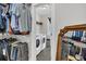 Walk-in closet with custom shelving for clothes, leading to the laundry room at 116 Backhurst Dr, Summerville, SC 29486