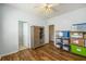 Bedroom with wood flooring, a closet, and a view into the adjacent bathroom at 117 Blue Bonnet St, Summerville, SC 29483