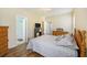 Comfortable bedroom with wood floors, ensuite bathroom, and neutral walls at 117 Blue Bonnet St, Summerville, SC 29483
