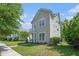 Charming two-story home featuring a quaint balcony, manicured lawn, and inviting front entrance at 117 Blue Bonnet St, Summerville, SC 29483