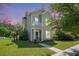 Charming two-story home featuring a quaint balcony, manicured lawn, and inviting front entrance at 117 Blue Bonnet St, Summerville, SC 29483